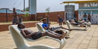 DUDUZA, SOUTH AFRICA - SEPTEMBER 28: Kids cool off at the state-of-the art  Duduza Swimming Pool on September 28, 2021 in Duduza, South Africa. The state-of-the -art multipurpose pool costed over 15 million and It is fitted with changing rooms, showers with hot and cold water, grandstands and bathrooms. (Photo by Gallo Images/OJ Koloti)