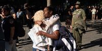NEW YORK, NEW YORK - SEPTEMBER 11: People embrace during the annual 9/11 Commemoration Ceremony at the National 9/11 Memorial and Museum on September 11, 2025 in New York City. Government officials joined family, friends, and first responders as they gathered at Ground Zero honoring the lives of their loved ones on the 24th anniversary of the terror attacks of September 11, 2001, at the World Trade Center. (Photo by Adam Gray/Getty Images)