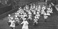circa 1930:  A group of chefs doing exercises on a rooftop.  (Photo by Hulton Archive/Getty Images)