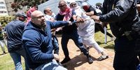 Tensions were high. The breaking point came when a pro-Palestine protester (right) tried to remove an Israeli flag from a pro-Israel protester (left). (Photo: Ashraf Hendricks)
