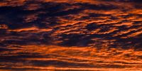 The light of the setting sun creates a dramatic illumination of the clouds in the evening sky over Berlin, Germany, 18 September 2023. Meteorologist predict cloudy weather conditions with temperatures of around 21 degrees Celsius in the upcoming days in the German capital.  EPA-EFE/Filip Singer