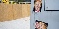 Stickers with an image of President Donald Trump near a business boarded up in Washington, D.C., U.S., on Wednesday, Oct. 28, 2020. After being caught off guard during nationwide social unrest this summer and suffering millions in damages, retailers are prepping for another possible bout of vandalism on Election Day. Photographer: Stefani Reynolds/Bloomberg via Getty Images