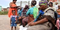 Aid volunteer Nomasomi Mbambo assisting women who are struggling to access the child grant and are depending on soup kitchens for food in the Eastern Cape. (Photo: Deon Ferreira)
