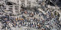 Rescue workers sift through the wreckage of the World Trade Center September 13, 2001 in New York City, two days after two hijacked airplanes slammed into the twin towers, levelling them in an alleged terrorist attack.  (Photo by Mario Tama/Getty Images)