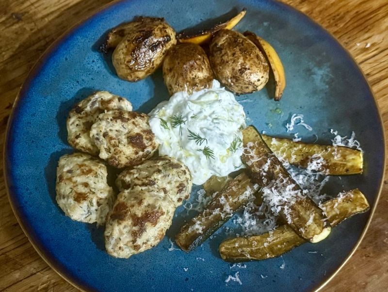 Keftedes (Greek meatballs) with lemon potatoes and courgettes
