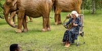 LONDON, ENGLAND - JUNE 22: Camilla, Duchess of Cornwall, Patron of the National Literacy Trust and Joint President of Elephant Family, reads Elmer as she launches their Story Trail at a picnic with school pupils, alongside the elephant sculptures recently installed in St James's Park on June 22, 2021 in London, England. (Photo by WPA Pool/Getty Images)