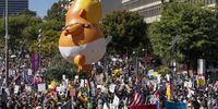  'No Kings' protesters at Grand Park in Los Angeles, bear aloft a giant, inflatable baby Donald Trump. (Photo: Jill Connelly / EPA)