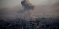 Smoke rises from Israeli air raids on 13 October in Gaza City. (Photo: Ahmad Hasaballah / Getty Images)