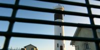 Lighthouse behind bars. Taken at Hangklip, Pringle Bay. Image: Karin Linder