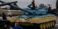 KYIV, UKRAINE - FEBRUARY 16: Children play on tanks displayed at the Motherland Monument on the newly created "Unity Day" on February 16, 2022, in Kyiv, Ukraine. "Unity Day" was created by Ukraine's president this week, in response to news reports that February 16 would be the date Russian forces invade Ukraine after Russian forces have been massing on the Ukrainian border over the past months.  (Photo by Chris McGrath/Getty Images)