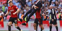  FA Cup - Final - Manchester City v Manchester United - Wembley Stadium, London, Britain - May 25, 2024<br>Manchester United manager Erik ten Hag and Lisandro Martinez celebrate after winning the FA Cup Action Images via Reuters/Andrew Couldridge