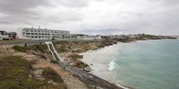 The shorefront of Arniston from the shipwreck memorial, over the hotel, towards the fishing village of Kassiesbaai. Photographer: Chris Marais