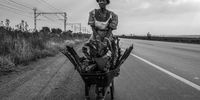 Cina Ndlovu gathers firewood at the roadside as she has no electricity at her home. Arbor, Mpumalanga. (Photo: Daylin Paul)
