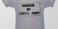 A simple silk screened T-shirt with a powerful struggle slogan.