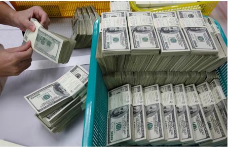 Dollar bounces on rise in yields as trade war roils markets