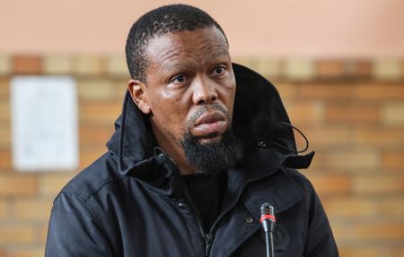 Former elite cop charged with assassinating ‘Witness D’ as mastermind at large