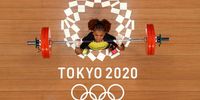 TOKYO, JAPAN - JULY 27:  Angie Paola Palacios Dajomes of Team Ecuador competes during the Weightlifting - Women's 64kg Group A on day four of the Tokyo 2020 Olympic Games at Tokyo International Forum on July 27, 2021 in Tokyo, Japan. (Photo by Chris Graythen/Getty Images)