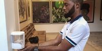 A Nigerian man washes his hands in an art gallery using a hand sanitiser station amid fears over the case of Coronavirus (Covid-19) in Lagos, Nigeria 10 March 2020. An Italian citizen who works in Nigeria tested positive for Covid-19 on 28 February 2020. The Nigeria Federal Ministry of Health said it has been working to identify all the contacts of the patient since he entered Nigeria. Fears are high that should Covid-19 gain traction in Africa, it could have devastating effects on some of the poorest and most vulnerable people on the planet. (Photo: EPA-EFE / Israel Ophori)