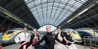 Ballerinas from the Kyiv City Ballet pose on a Eurostar platform at St Pancras Station on March 28, 2023 in London, England. Today, 32 ballet dancers from Ukraine's Kyiv City Ballet travelled by Eurostar from Paris to London. The Kyiv City Ballet will be performing at York Theatre Royal for a fundraising gala on Thursday 30th March. (Photo by Jeff Spicer/Getty Images for Eurostar )