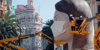epa08285614 Two workers put a mask to a Falla sculpture at City Hall square after regional authorities postponed the Fallas festival due to coronavirus in the city of Valencia, eastern Spain, 11 March 2020. Las Fallas festivity, Intangible Cultural Heritage of Humanity, is held annually in Valencia to mark Saint Joseph, the patron of carpenters from 15 to 19 March. The fallas, installations of parodic huge papier-mache, cardboard and wooden sculptures, are burned on 19 March in the so-called 'Crema' to end the event.  EPA-EFE/Kai Foersterling