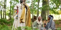 Members of the "Kingdom of Kubala," a self-styled tribe, 'King Atehene' and 'Queen Nandi' with handmaiden 'Asnat' on October 01, 2025 in Jedburgh, Scotland. The group, which has been camping in the area since May, recently moved to council-owned land here after being evicted from private land nearby. Today, the Selkirk Sheriff Court banned them from returning to their previous encampment, while a court order issued last week banned them from council land in the area. (Photo by Jeff J Mitchell/Getty Images)