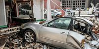 epa09436968 Bricks from a neighboring collapsed building pushed a vehicle into the wall of a local restaurant in the Central Business District due to winds from Hurricane Ida in New Orleans, Louisiana, USA, 30 August 2021. Hurricane Ida made landfall on the Louisiana coast the previous evening as a major hurricane with the Mississippi and Louisiana coastal areas preparing for storms surges, wind damage and flooding.  EPA-EFE/DAN ANDERSON