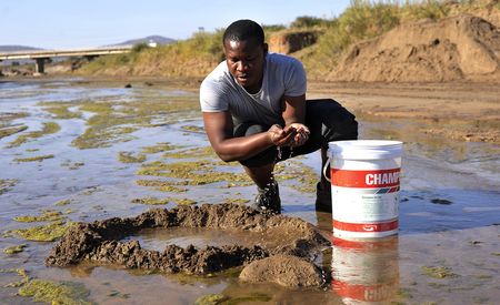 Villagers forced to scrape the earth for water