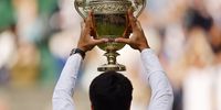 Carlos Alcaraz of Spain poses with the trophy after winning his Men's Singles final match against Novak Djokovic of Serbia at the Wimbledon Championships, Wimbledon, Britain, 16 July 2023.  EPA-EFE/TOLGA AKMEN   EDITORIAL USE ONLY  EDITORIAL USE ONLY