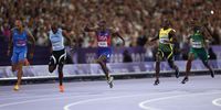PARIS, FRANCE - AUGUST 04: Noah Lyles of Team United States crosses the finish line to win the Men's 100m Final on day nine of the Olympic Games Paris 2024 at Stade de France on August 04, 2024 in Paris, France. (Photo by Patrick Smith/Getty Images)