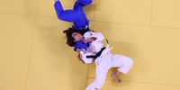 TOKYO, JAPAN - JULY 24: Catarina Costa of Team Portugal and Paula Pareto of TeamArgentina compete during the Women’s Judo 48kg Repechage contest on day one of the Tokyo 2020 Olympic Games at Nippon Budokan on July 24, 2021 in Tokyo, Japan. (Photo by Richard Heathcote/Getty Images)