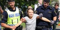 Swedish climate activist Greta Thunberg is carried away by police officers during a climate action in Oljehamnen, Malmo, Sweden, 24 July 2023. The action was carried out hours after Thunberg was found guilty by a Swedish court of disobeying a police order during a protest in the same location in June 2023.  EPA-EFE/Andreas Hillergren/TT SWEDEN OUT
