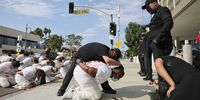  People participate in an performative art piece titled 'The Disappeared/Los Desaparecidos' that involves performers acting as law enforcement agents taking and arresting people, during a national day of nonviolent action against the Trump administration and deportations, outside of the Edward R. Roybal Federal Building in Los Angeles, California, USA, 17 July 2025. This event is part of a national day of nonviolent protest with topics that include: The John Lewis Voting Rights Advancement Act, The Freedom to Vote Act, The Native American Voting Rights Act, The DC Admission Act.  EPA/ALLISON DINNER