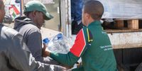 Residents of Graaf-Reinet begin to collect water from Gift of The Givers. (Photo: James Fowler)