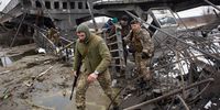 Ukrainian serviceman cross a destroyed bridge on 1 March 2022 in Irpin, Ukraine. (Photo: Anastasia Vlasova / Getty Images)