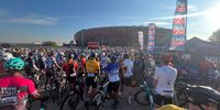 Thousands of cyclists lining up for the annual Ride Joburg with the silhouette of Johannesburg and FNB stadium in the back.  Photographer: Jaco Steyn