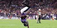 BALTIMORE, MARYLAND - SEPTEMBER 19: Lamar Jackson #8 of the Baltimore Ravens flips into the end zone for a touchdown against the Kansas City Chiefs during the fourth quarter at M&amp;T Bank Stadium on September 19, 2021 in Baltimore, Maryland. (Photo by Rob Carr/Getty Images)
