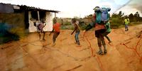 Joseph Makowa plays a game of football with children from a small village. (Screengrab: Wild Africa Fund)