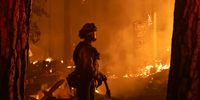 A firefighter monitors a fire as structures burn in the Indian Falls neighborhood near Crescent Mills, California on 24 July 2021. Global warming of 1.09°C has already caused widespread impacts globally. In the past several years, we’ve seen enormous wildfires sweep across Australia, Chile, the US and Greece. (Photo: David Odisho / Bloomberg via Getty Images)