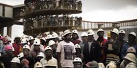 Mine workers at Harmony Gold's Doornkop mine gather to mourn their colleagues who died in a mining accident in Doornkop, southwest of Johannesburg, on 6 February 2014. (Photo: Marco Longari / AFP)