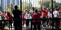 EFF and ANC members protest outside the Pretoria High School For Girls after an alleged racist incident on July 30, 2024 in Pretoria, South Africa. It is reported that the Principal has been temporarily suspended amid the controversy over racial notes made by pupil on a WhatsApp group. (Photo by Gallo Images/Beeld/Deaan Vivier)