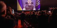 CANNES, FRANCE - MAY 17: President of Ukraine Volodymyr Zelenskyy speaks in a live link-up video during the opening ceremony for the 75th annual Cannes film festival at Palais des Festivals on May 17, 2022 in Cannes, France. (Photo by Andreas Rentz/Getty Images)