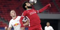 Lukas Klostermann (L) of RB Leipzig fights for the ball with Mohamed Salah of Liverpool  during the UEFA Champions League round of 16, second leg, soccer match between Liverpool FC and RB Leipzig at Puskas Ferenc Arena in Budapest, Hungary, 10 March 2021  (Photo: EPA-EFE/Szilard Koszticsak)