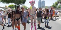 People attend the Gay Pride Parade in Tel Aviv, Israel, 10 June 2022. Tens of thousands of people took part at the annual Tel Aviv Pride Parade supporting the LGBTI (lesbian, gay, bisexual, transgender, and intersex) community.  EPA-EFE/ABIR SULTAN