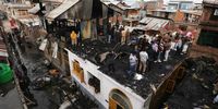 Kashmiri people inspect damaged houses following a fire in Srinagar, the summer capital of Indian Kashmir, 10 February 2025. The fire, which reported no casualties, left at least five residential houses destroyed, according to officials.  EPA-EFE/FAROOQ KHAN