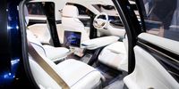 The interior of Foxconn Technology Group's Foxtron Model E concept electric sedan unveiled at the Hon Hai Tech Day event in Taipei, Taiwan, on Monday, Oct. 18, 2021. Foxconn unveiled its first electric vehicles, a milestone that could boost the Taiwanese electronics manufacturer's credentials as a serious bidder for Apple Inc.'s secretive automotive project. Photographer: I-Hwa Cheng/Bloomberg via Getty Images