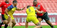 Giovanni Licata (c) of Zebre tries to stop Asenathi Ntlabakanye of the Emirates Lions during the United Rugby Championship match between Emirates Lions and Zebre at Emirates Airline Park on November 25, 2023 in Johannesburg, South Africa. (Photo by Gordon Arons/Gallo Images)
