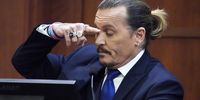 epa09909107 US actor Johny Depp gestures as to where a can of mineral spirits he says actress Amber Heard threw hit him, as he testifies in the courtroom at the Fairfax County Circuit Courthouse in Fairfax, Virginia, USA, 25 April 2022. Johnny Depp's 50 million US dollar defamation lawsuit against Amber Heard that started on 10 April is expected to last five or six weeks.  EPA-EFE/Steve Helber / POOL
