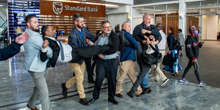 Kumi Naidoo forcibly removed from Standard Bank HQ after protest over crude oil pipeline project