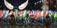 Floriane Issert, a Gendarmerie non-commissioned officer of the National Gendarmerie, carries the Olympic flag as she rides on the Iena bridge during the Opening Ceremony of the Olympic Games Paris 2024 on July 26, 2024 in Paris, France. (Photo by Stephanie Lecocq - Pool/Getty Images)