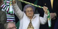 An elderly Norwich City fan celebrates as her team win the match and secure winning League One as champions during the Coca Cola League One match between Norwich City and Gillingham at Carrow Road on April 24, 2010 in Norwich, England. (Photo by Jed Leicester/Getty Images)